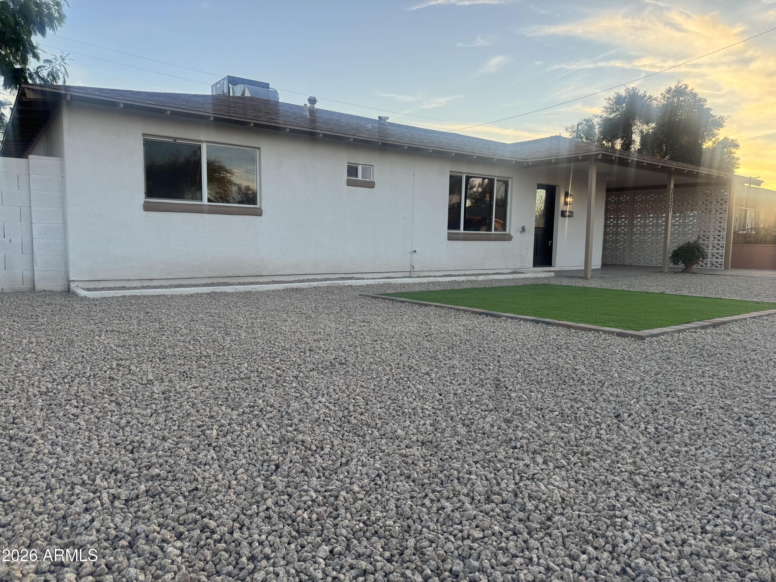 3337 West Ocotillo Road Phoenix, AZ 85017 - Photo 8 of 22 a front view of a house with a yard