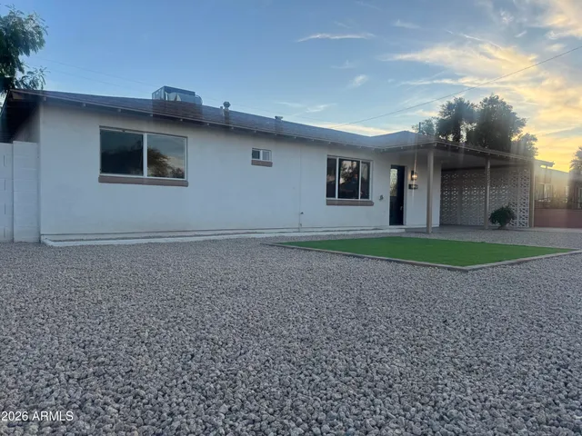 a house with trees in the background