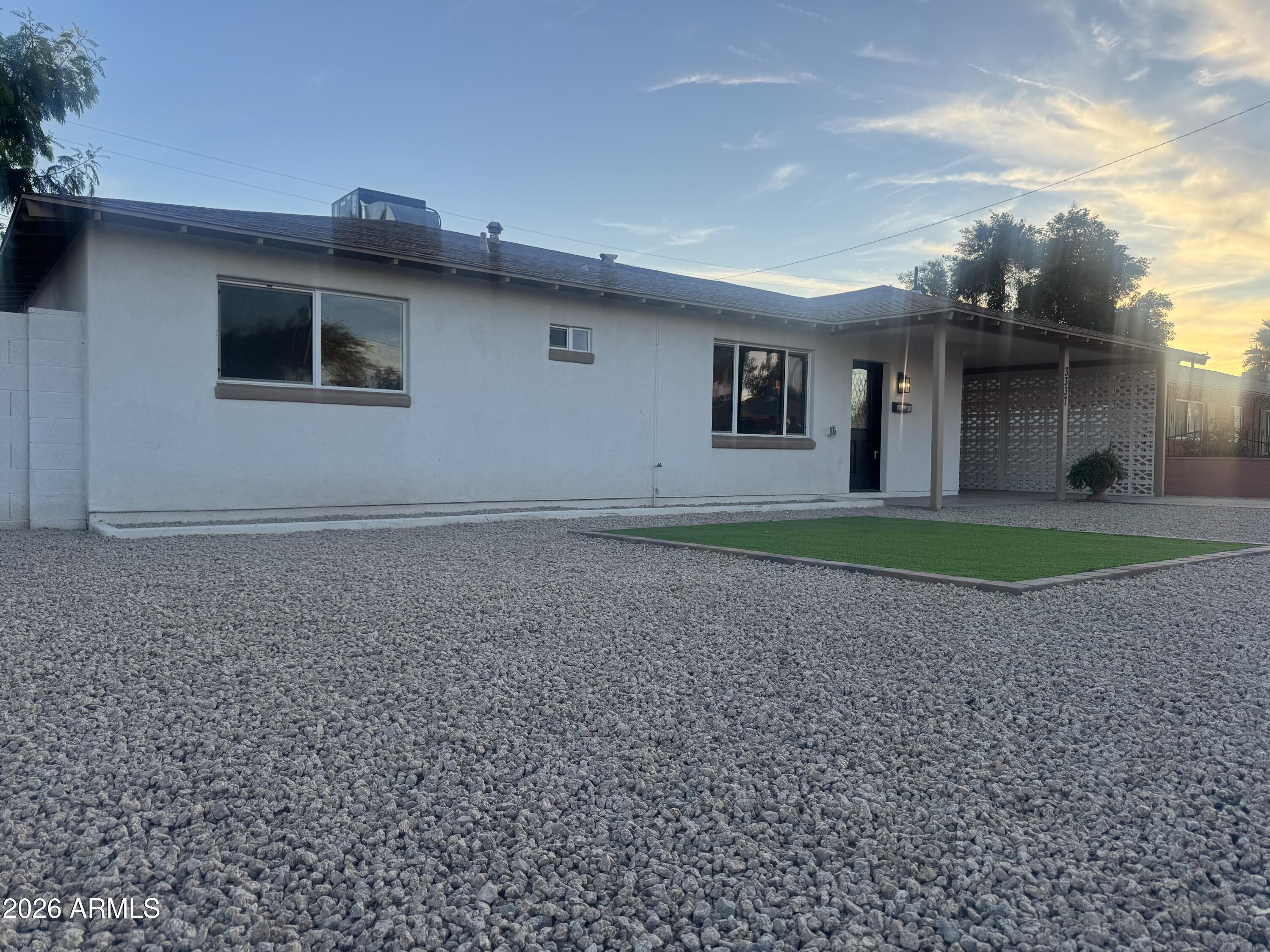 3337 West Ocotillo Road Phoenix, AZ 85017 - Photo 10 of 22 a house with trees in the background