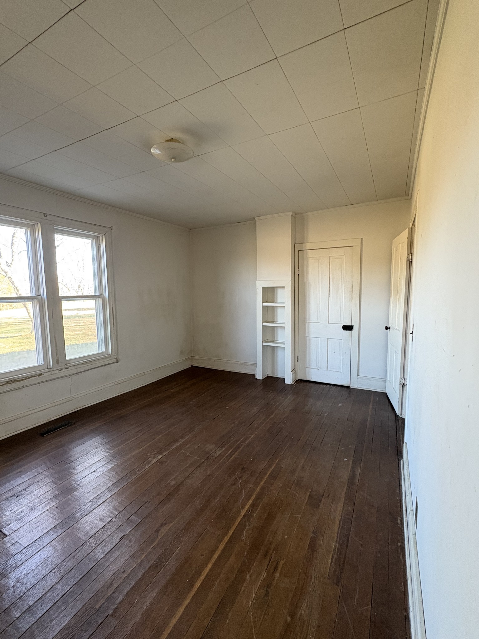 328 Lafayette Road Red Boiling Springs, TN 37150 - Photo 27 of 34 an empty room with wooden floor and windows