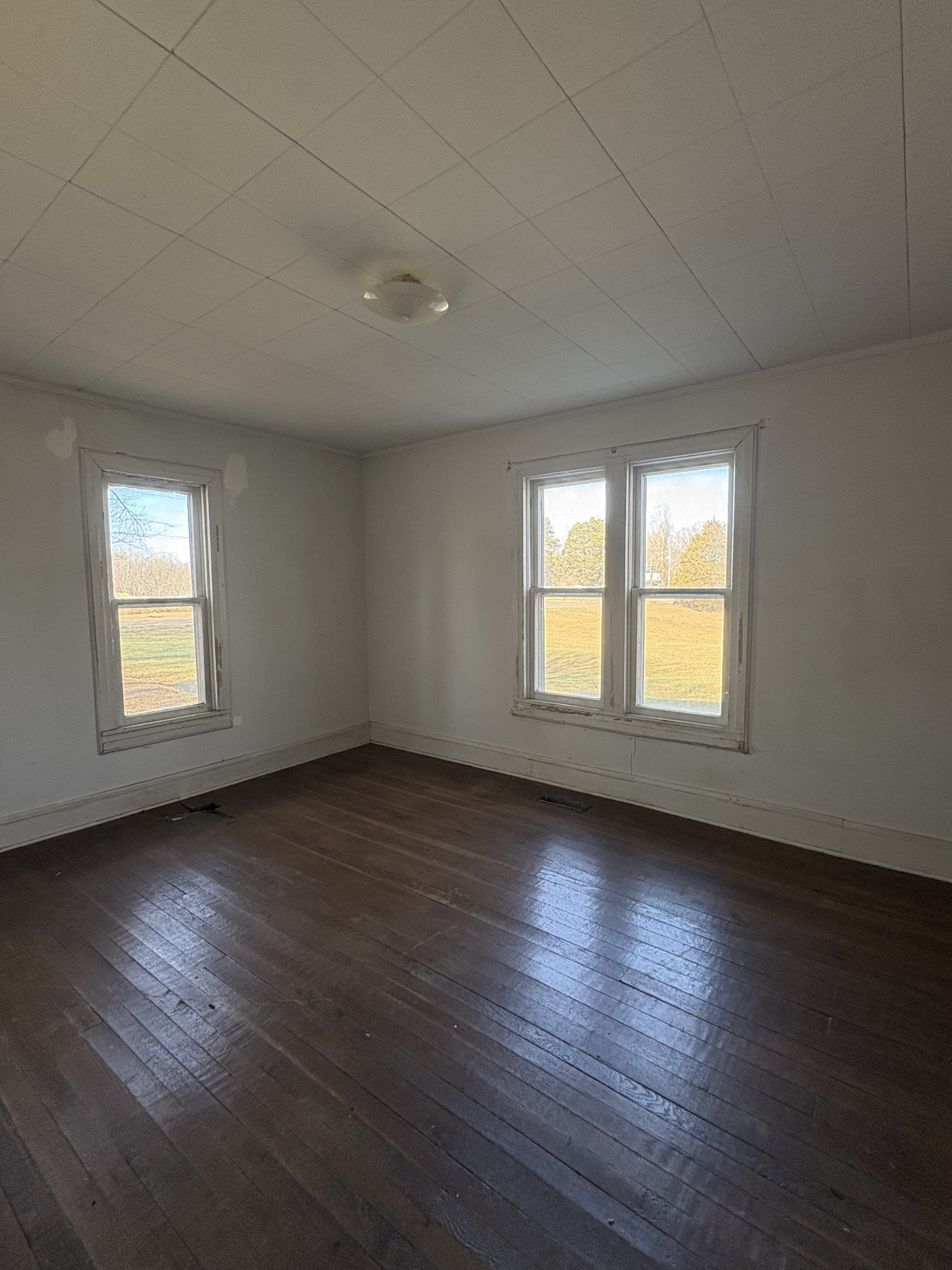 328 Lafayette Road Red Boiling Springs, TN 37150 - Photo 29 of 34 an empty room with wooden floor and windows