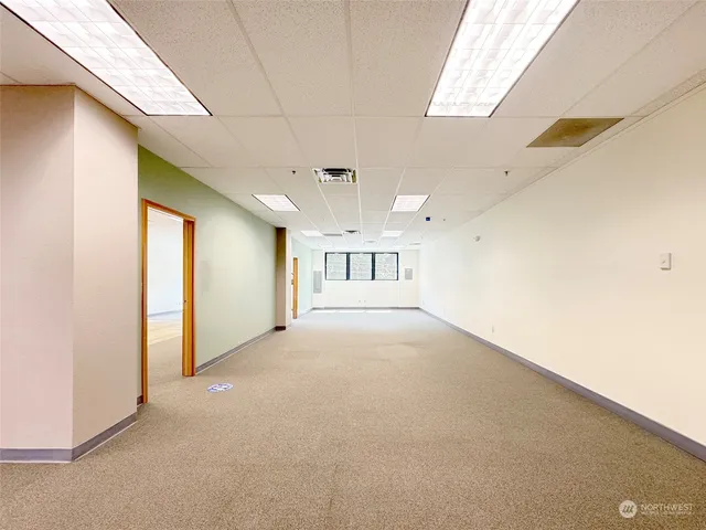 a view of an empty room with a window