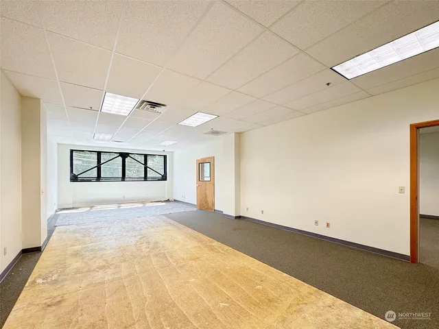 a view of a patio with table and chairs with wooden floor and fence