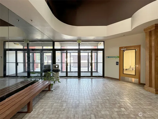a view of a livingroom with a kitchen