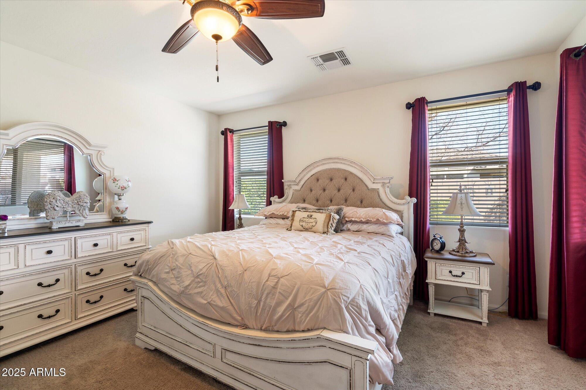 9010 West Ruth Avenue Peoria, AZ 85345 - Photo 14 of 26 a bedroom with a bed and a dresser