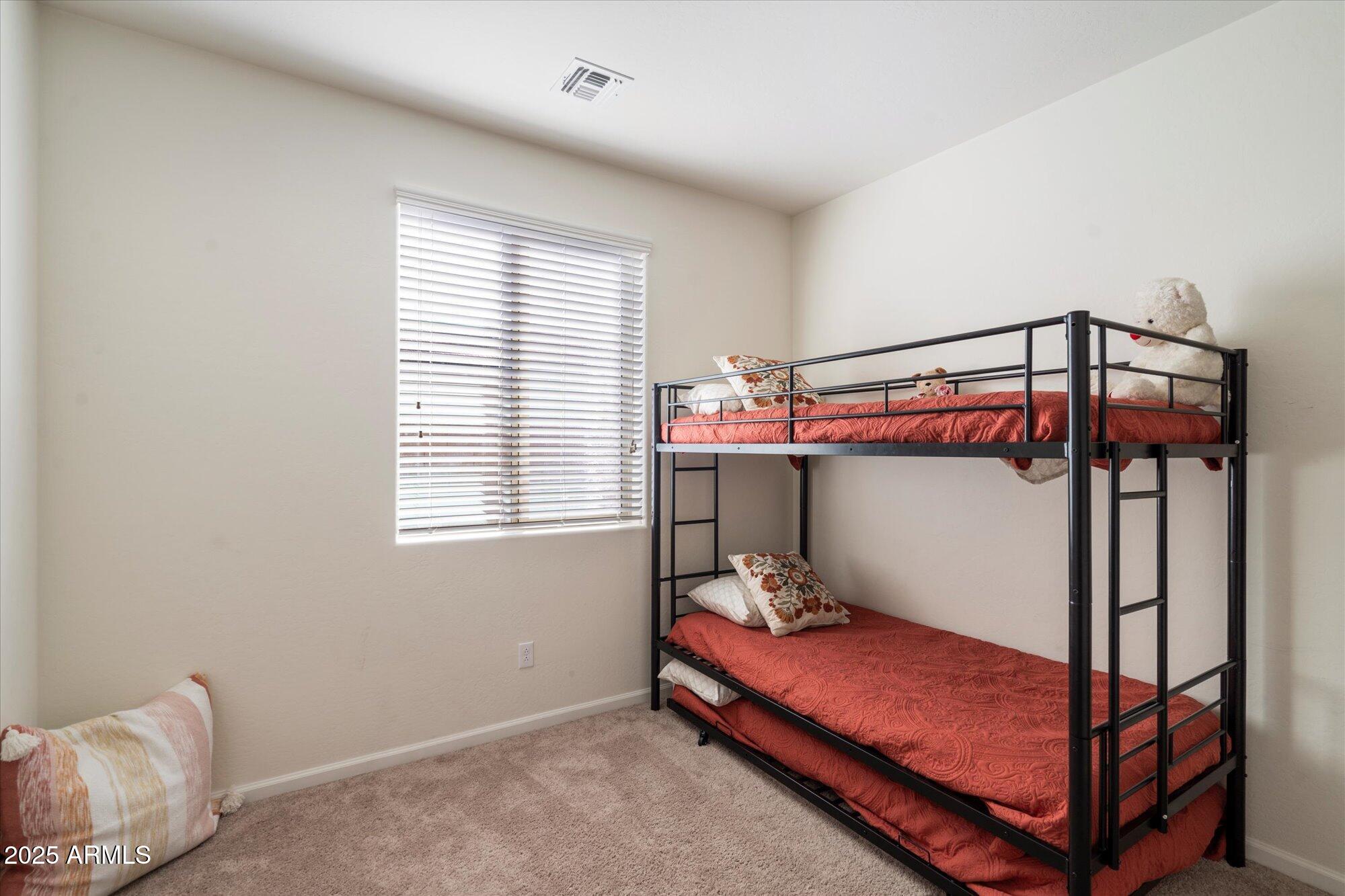 9010 West Ruth Avenue Peoria, AZ 85345 - Photo 19 of 26 a bed room with a bed and a window