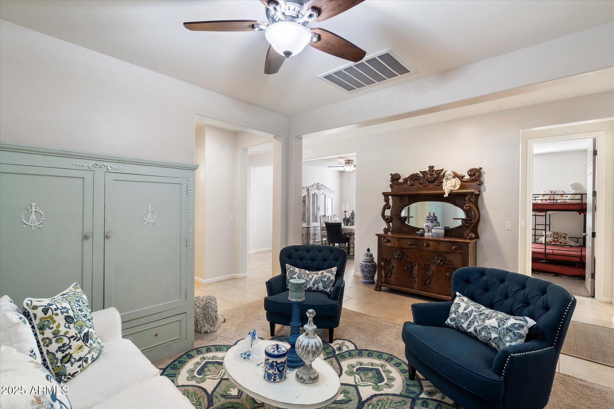 9010 West Ruth Avenue Peoria, AZ 85345 - Photo 3 of 26 a living room with furniture and a wooden floor