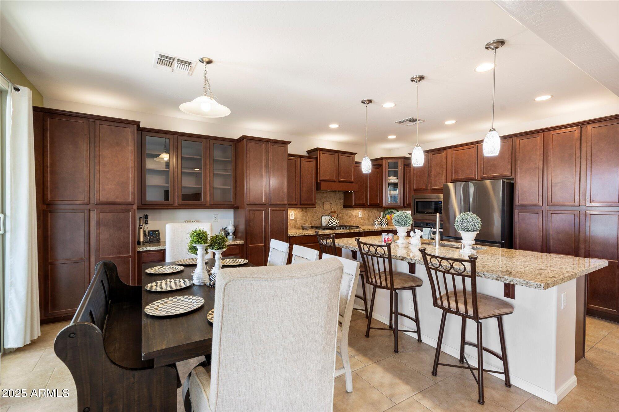 9010 West Ruth Avenue Peoria, AZ 85345 - Photo 8 of 26 a view of a dining room with furniture
