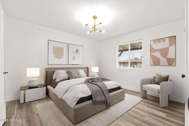 a spacious bedroom with a bed and a couch