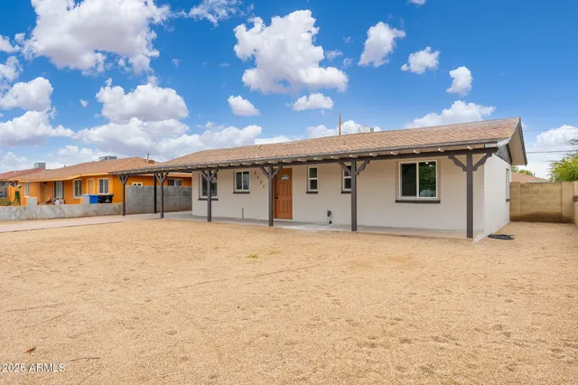 a front view of a house with parking space