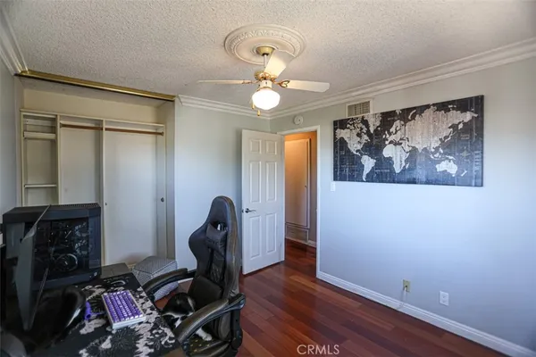 a view of a workspace with wooden floor and workspace