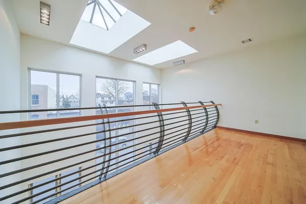 a view of a room with window and a ceiling fan