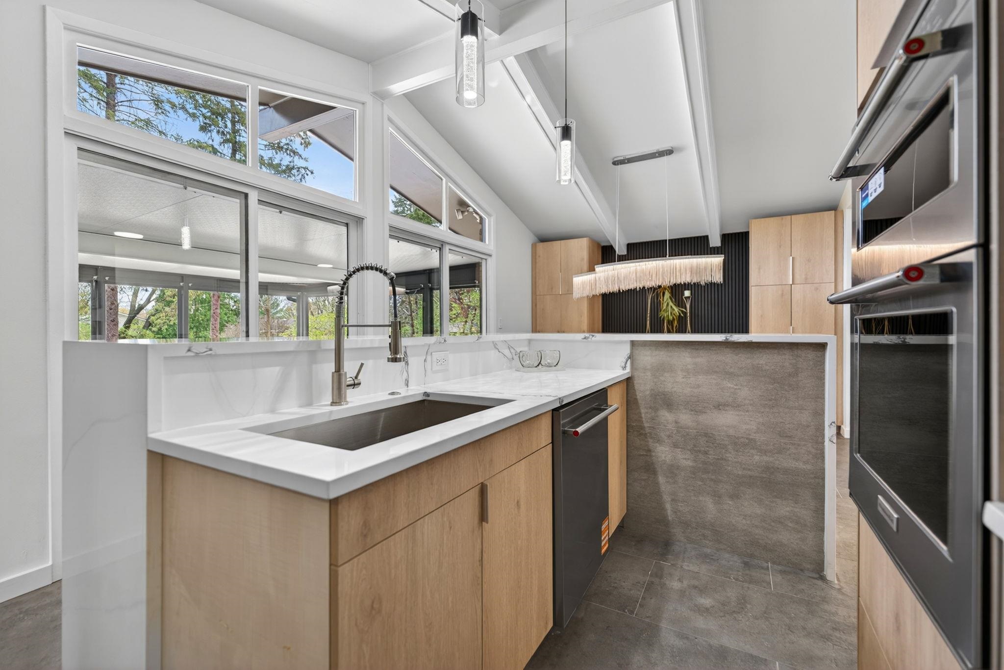 5075 Welsh Road Rockford, IL 61107 - Photo 16 of 54 a kitchen with stainless steel appliances a sink and a refrigerator