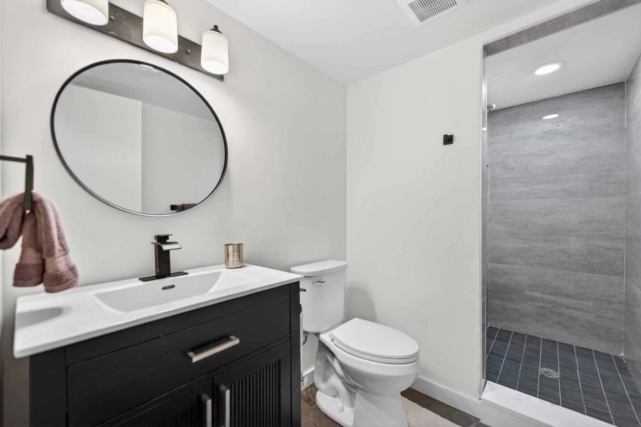 5075 Welsh Road Rockford, IL 61107 - Photo 23 of 54 a bathroom with a sink and a mirror