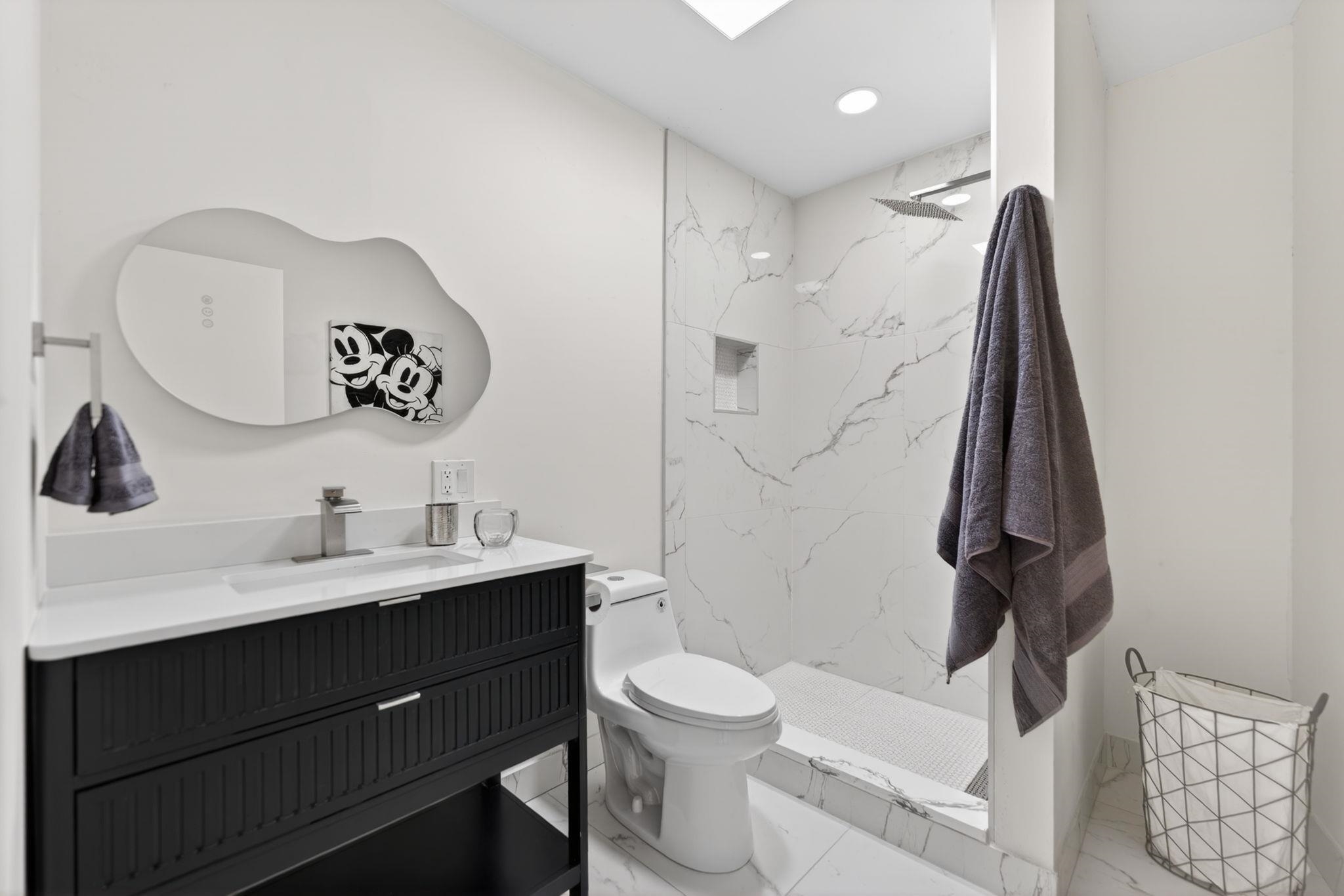 5075 Welsh Road Rockford, IL 61107 - Photo 35 of 54 a bathroom with a toilet sink and mirror