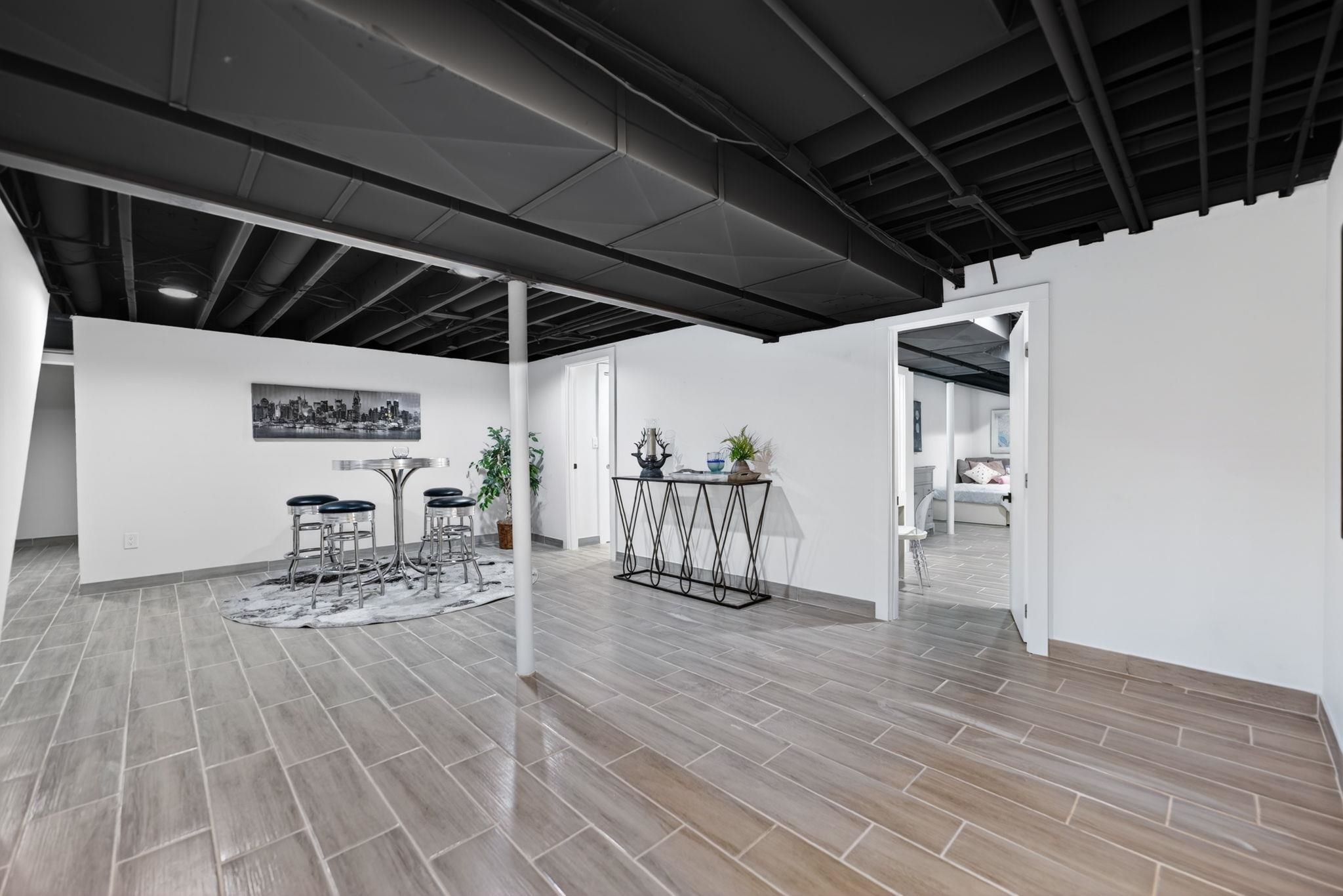 5075 Welsh Road Rockford, IL 61107 - Photo 36 of 54 a view of a patio with table and chairs with wooden floor