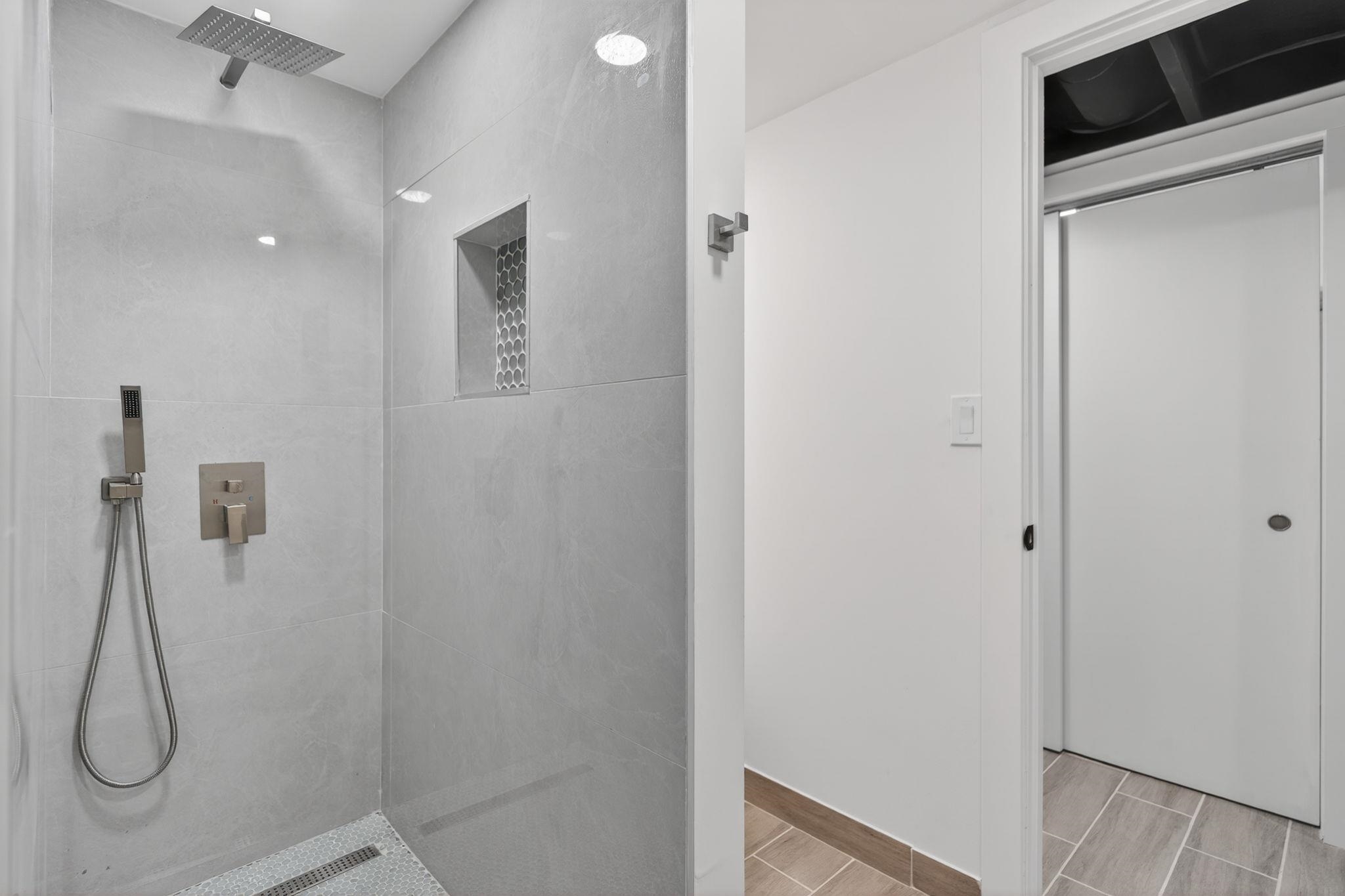 5075 Welsh Road Rockford, IL 61107 - Photo 49 of 54 a bathroom with a glass shower door