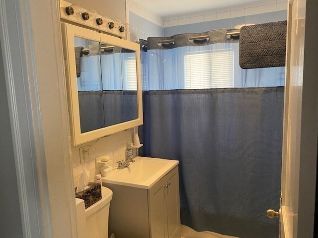 70 Prospect Street, Unit 70 Watertown, MA 02472 - Photo 5 of 9 a bathroom with a sink and mirror