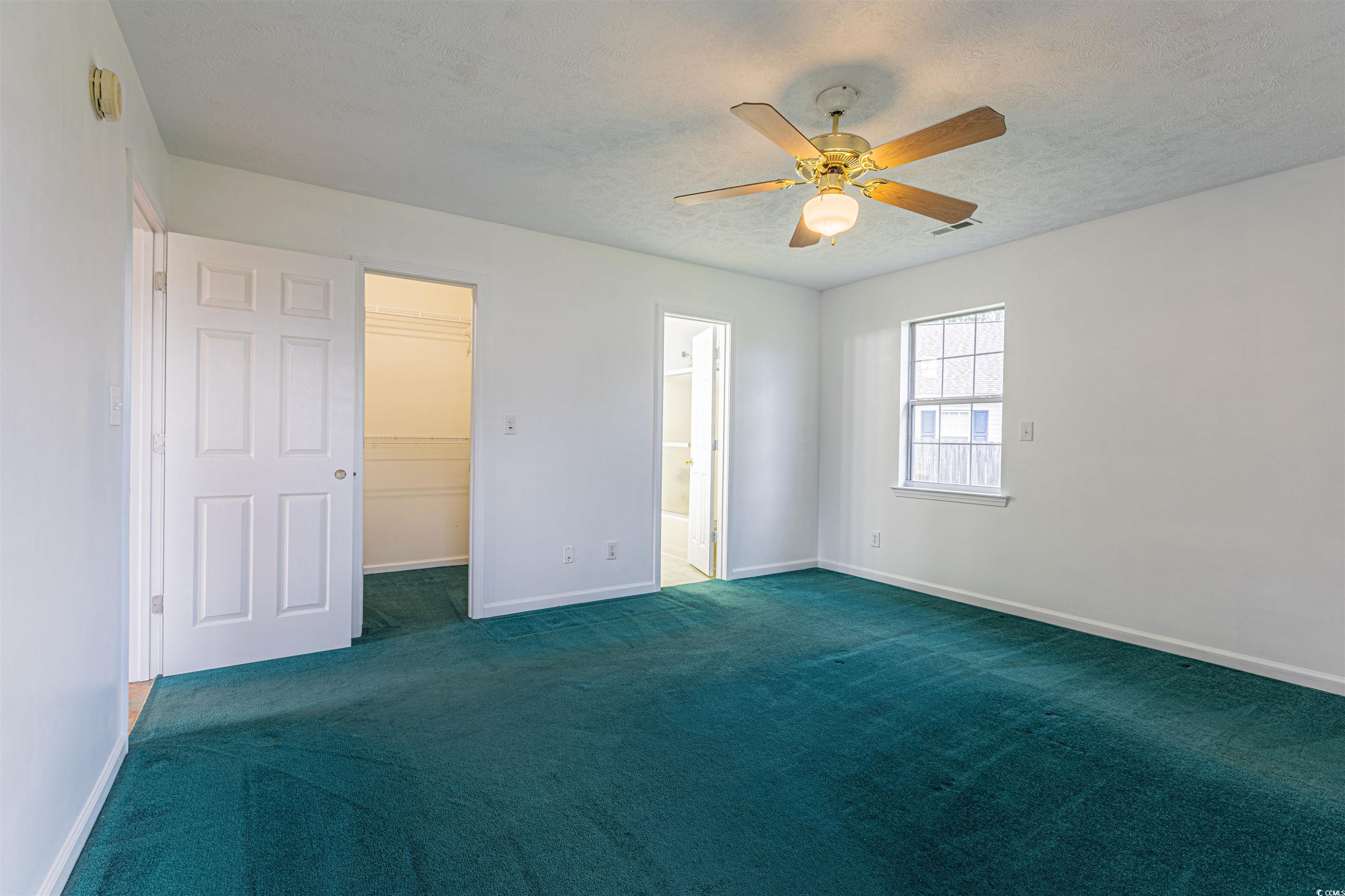 8089 Bark Court Murrells Inlet, SC 29576 - Photo 10 of 30 Carpeted spare room featuring ceiling fan and loft