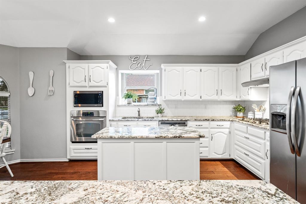2302 Randi Road Rowlett, TX 75088 - Photo 8 of 33 a kitchen with stainless steel appliances granite countertop a refrigerator sink and stove