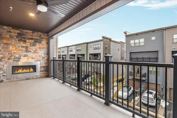 a view of a porch with a table and a fireplace
