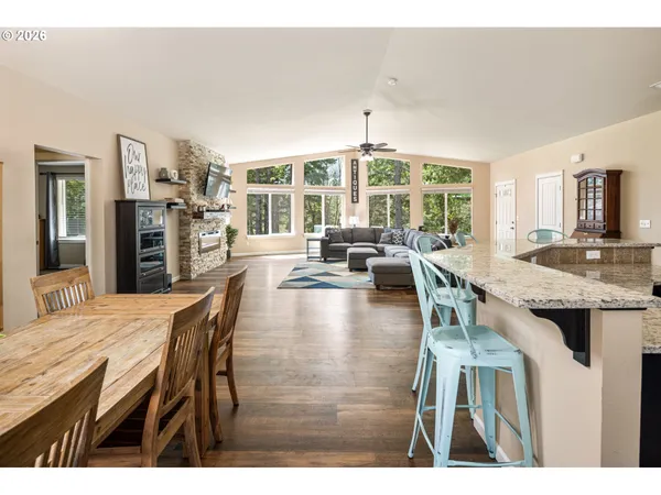 a view of a dining room with furniture window and outside view