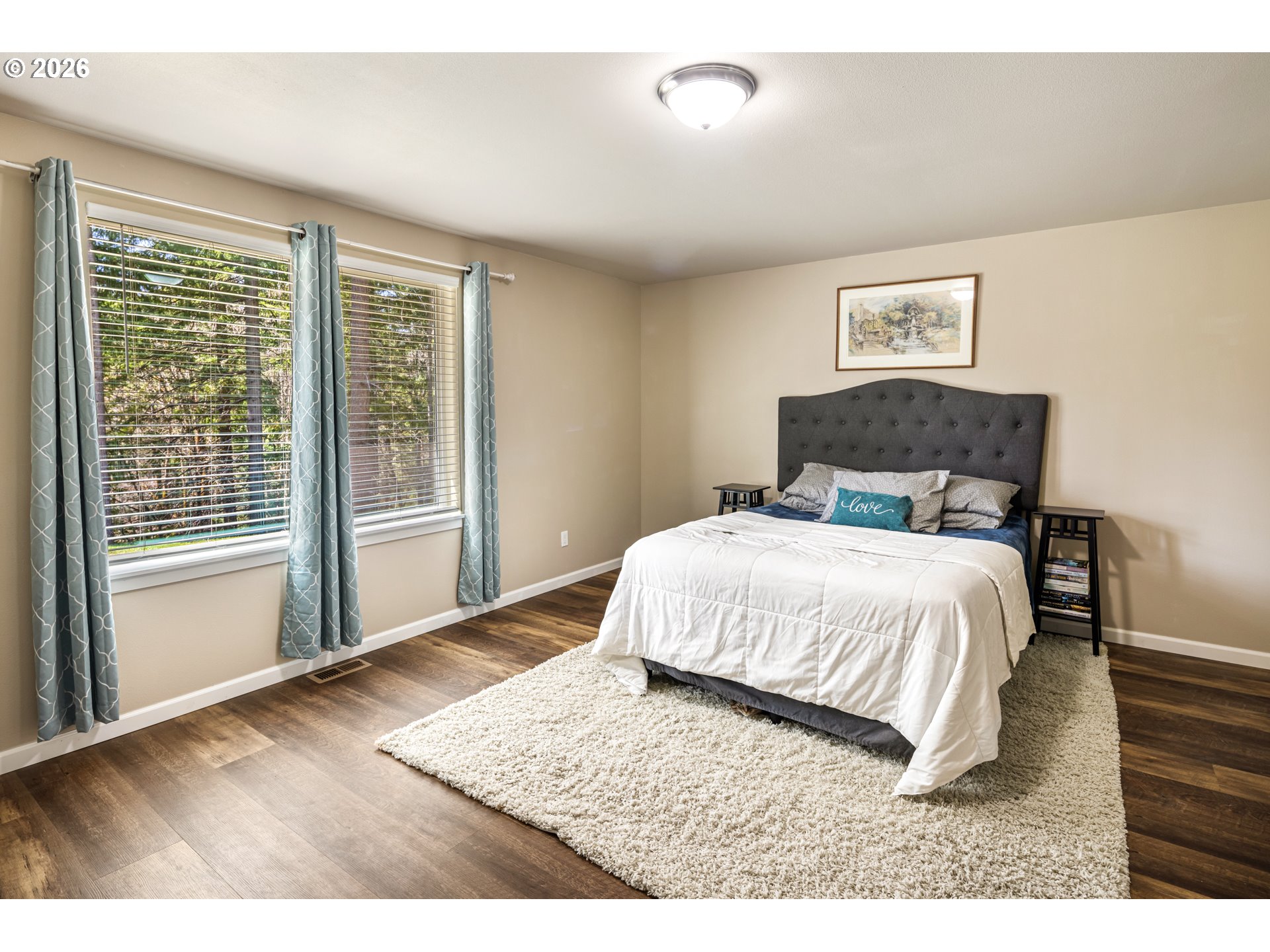 1452 Lacock-Kelchner Road Underwood, WA 98651 - Photo 17 of 40 a bedroom with a bed and wooden floor