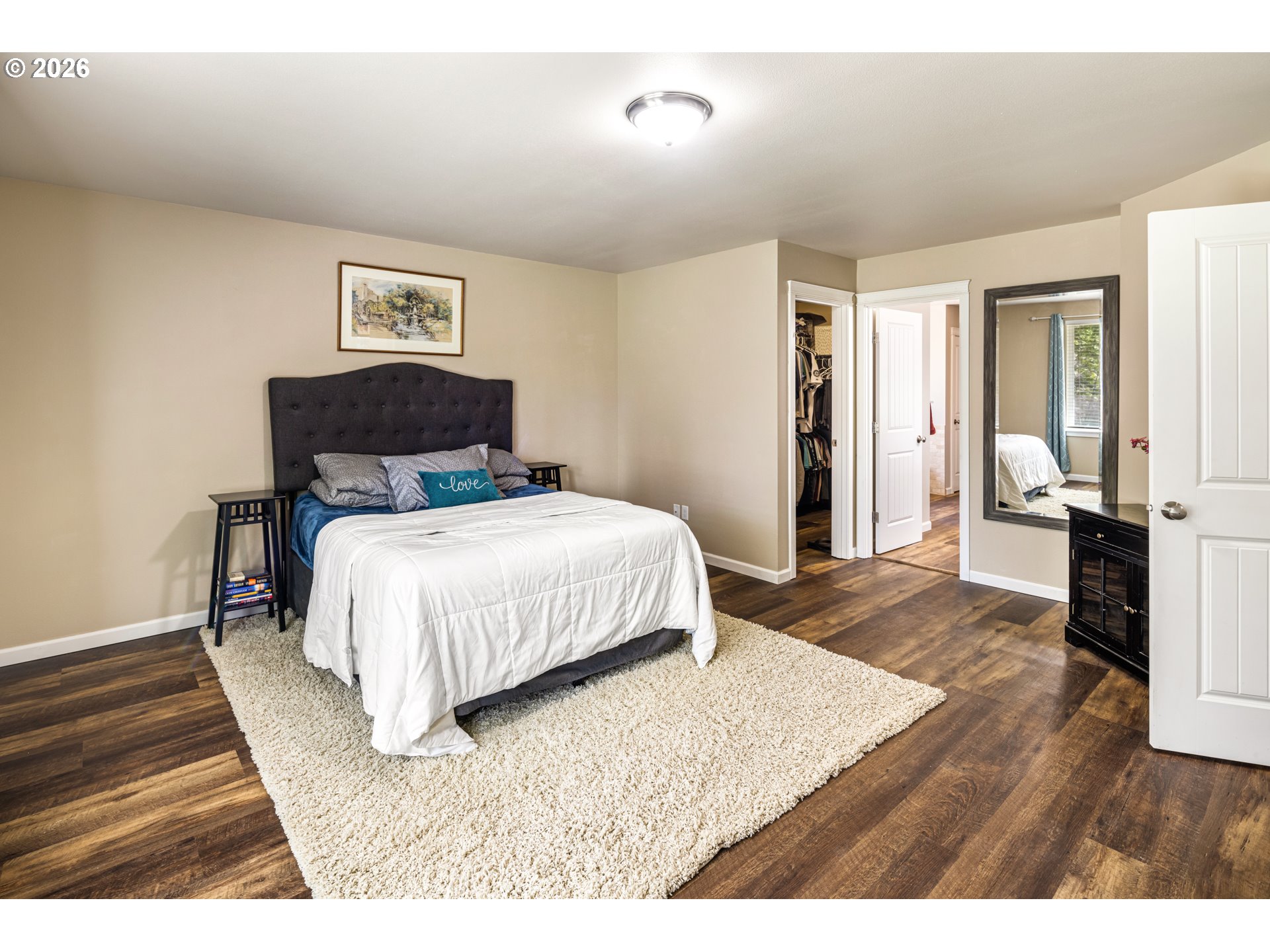 1452 Lacock-Kelchner Road Underwood, WA 98651 - Photo 18 of 40 a bedroom with a bed and wooden floor