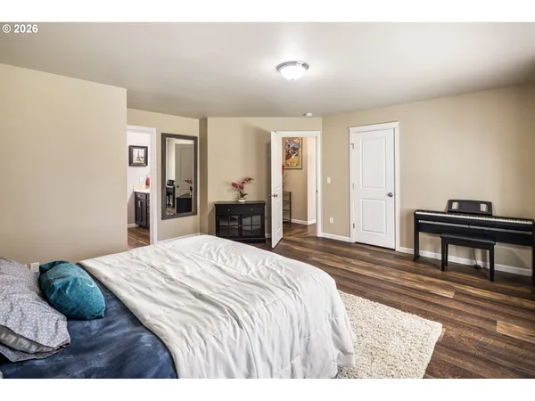a bedroom with a bed and a dresser