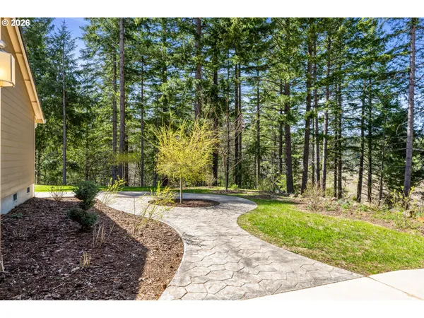a backyard of a house with yard and outdoor seating