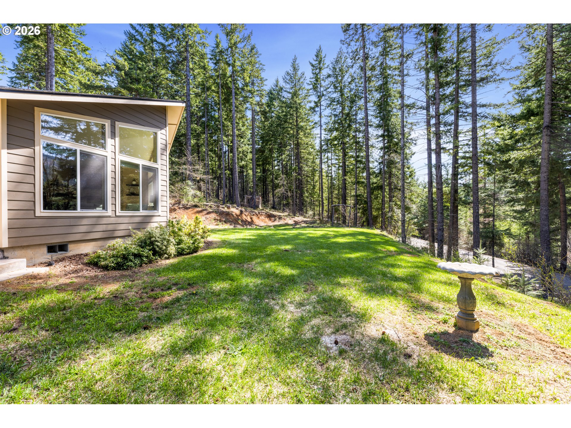 1452 Lacock-Kelchner Road Underwood, WA 98651 - Photo 31 of 40 a backyard of a house with lots of green space