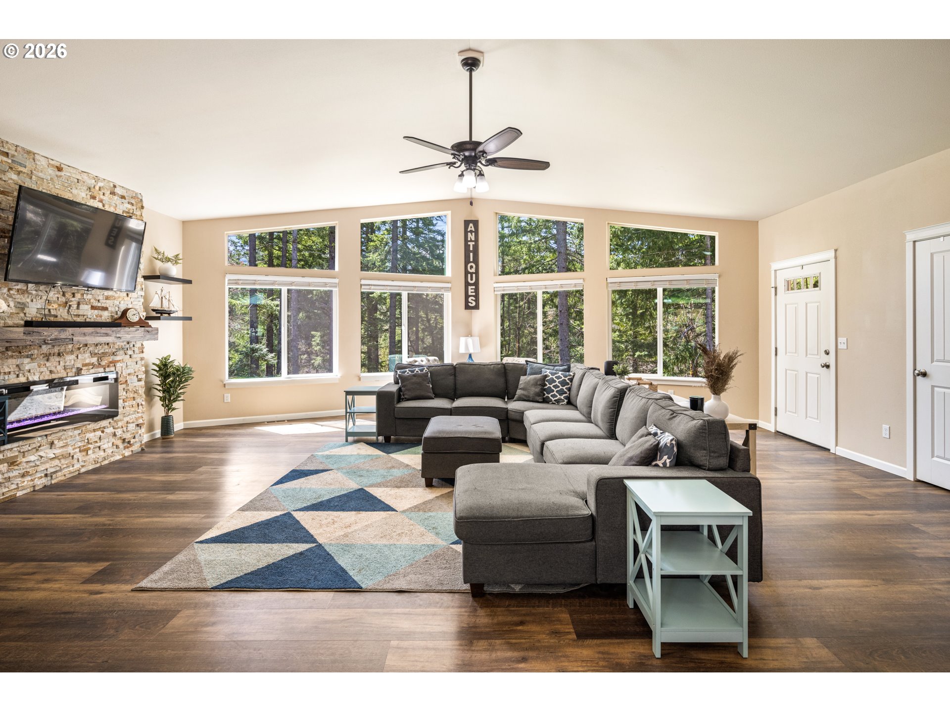1452 Lacock-Kelchner Road Underwood, WA 98651 - Photo 4 of 40 a living room with furniture and a flat screen tv