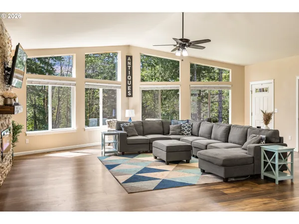 a living room with furniture and a large window