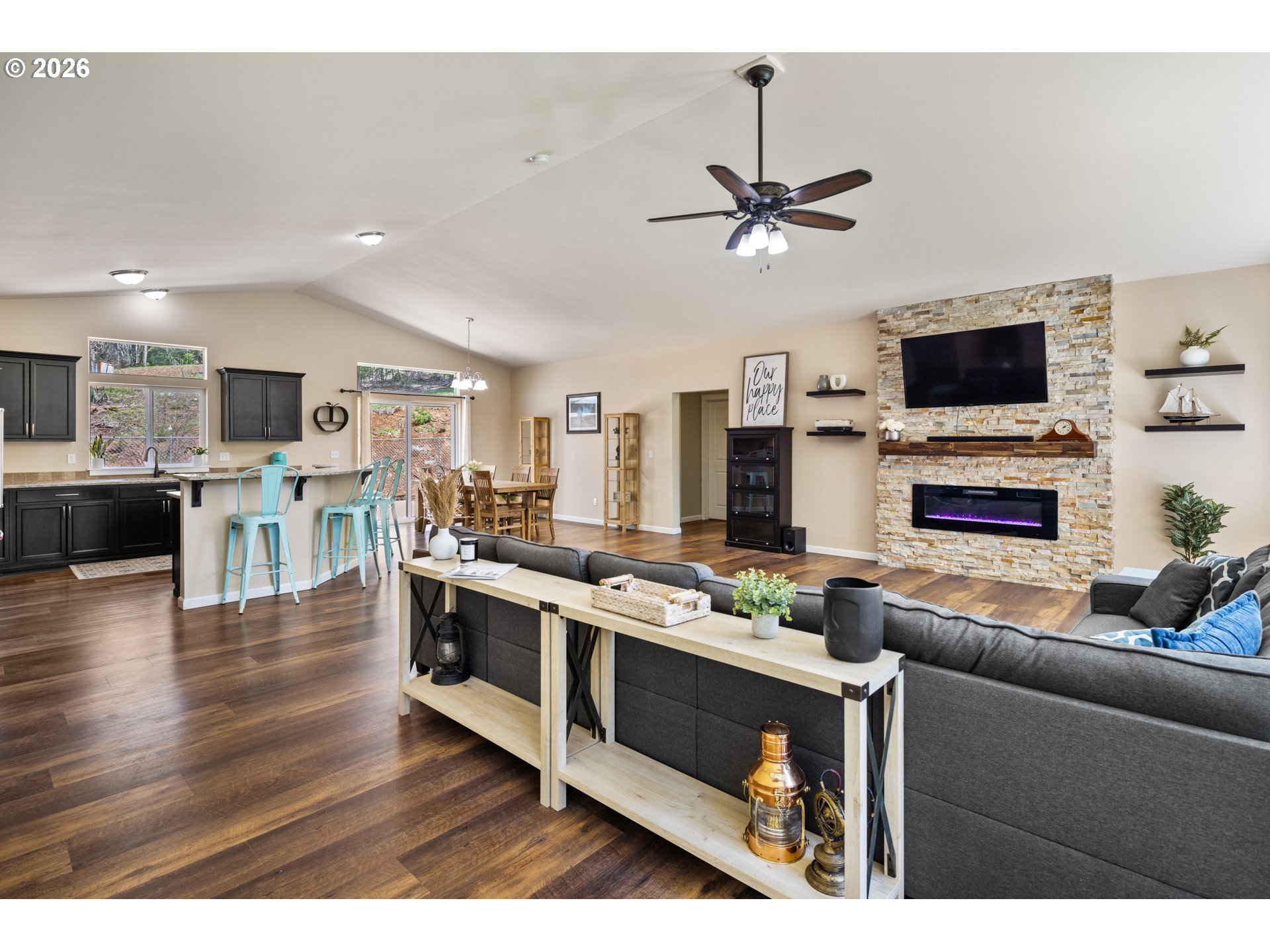 1452 Lacock-Kelchner Road Underwood, WA 98651 - Photo 6 of 40 a living room with stainless steel appliances kitchen island granite countertop a stove top oven a sink a dining table and chairs