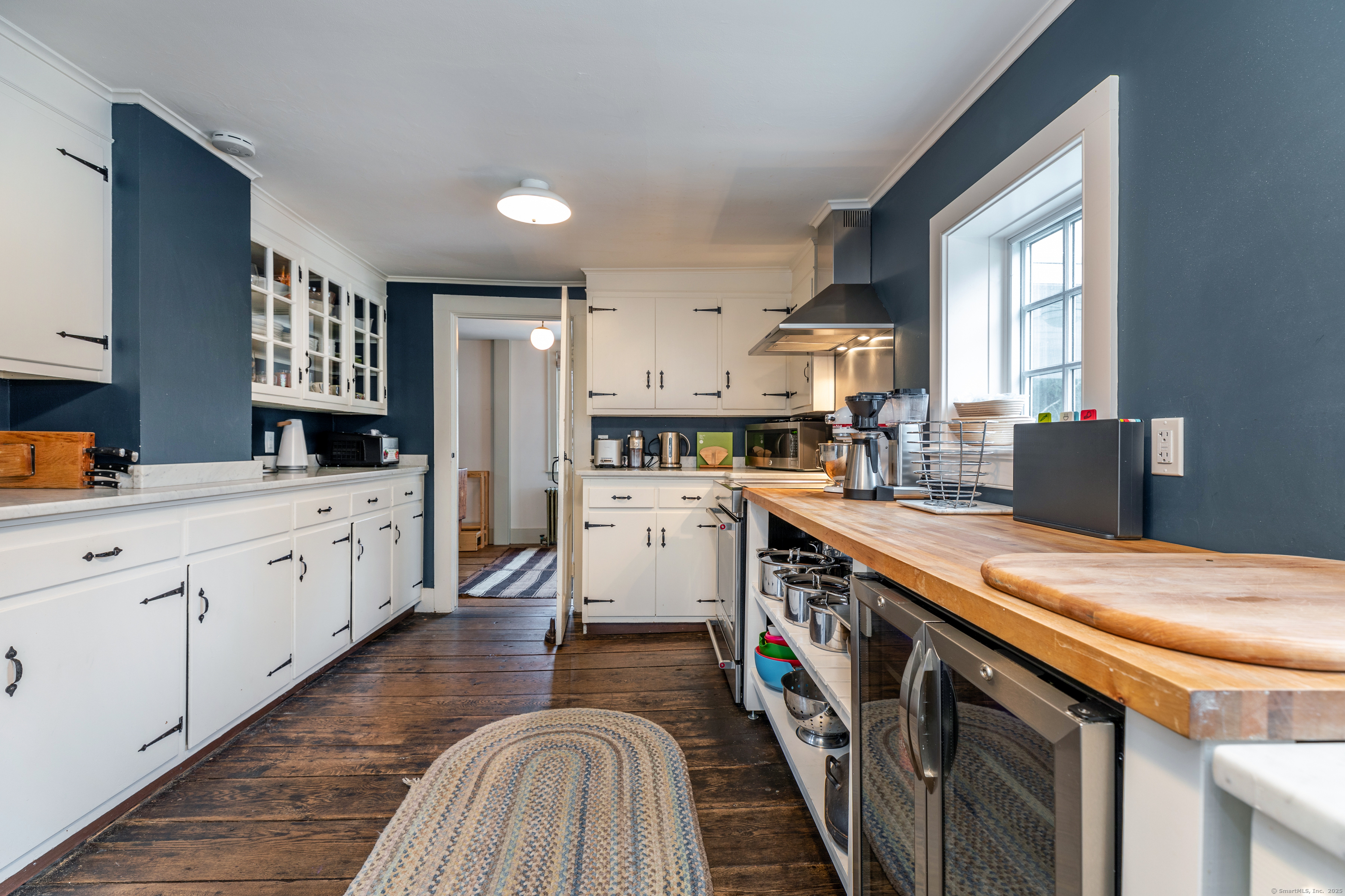 12 South Kent Road New Milford, CT 06755 - Photo 11 of 31 a kitchen with a sink stove and cabinets
