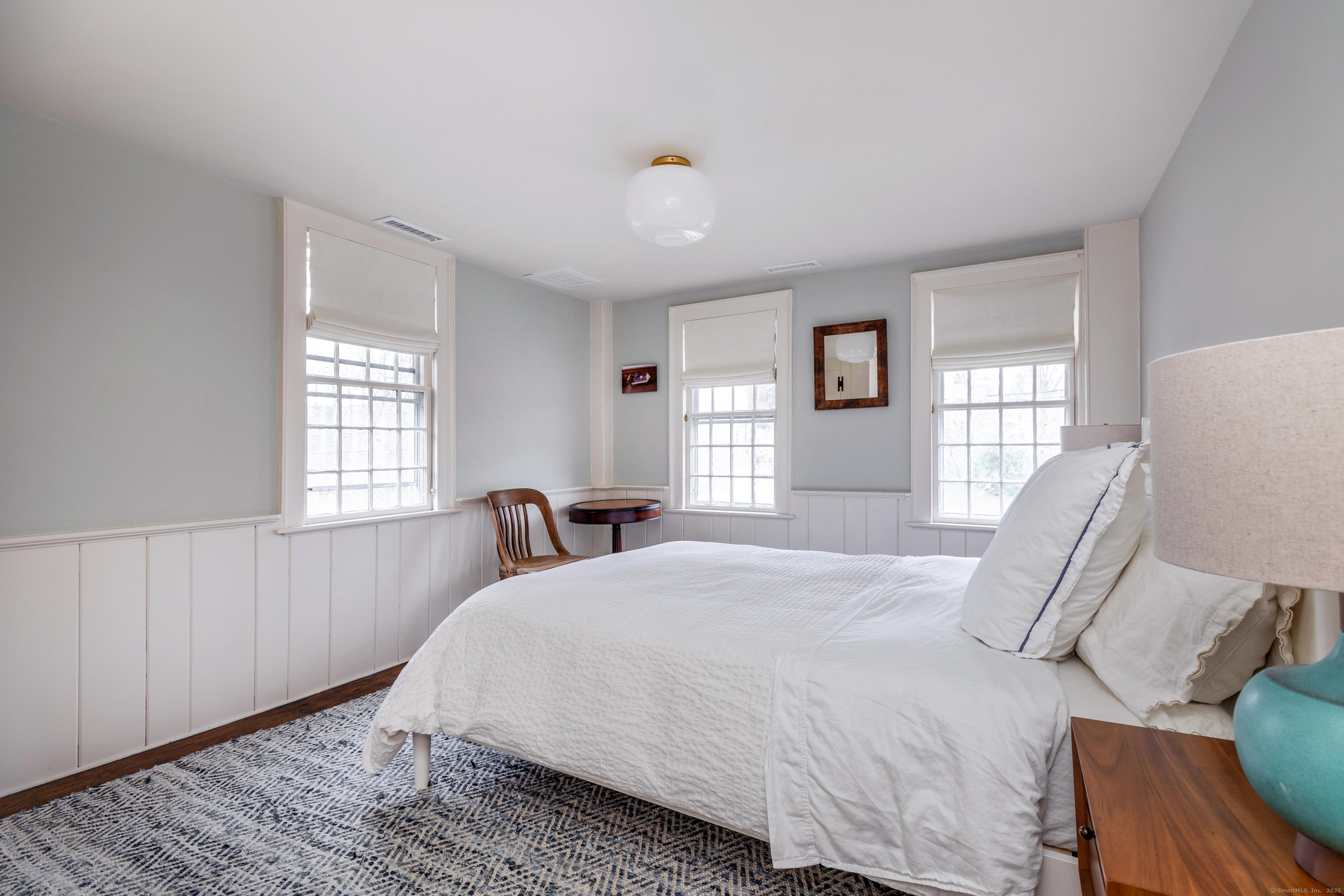 12 South Kent Road New Milford, CT 06755 - Photo 17 of 31 a bedroom with a bed and wooden floor