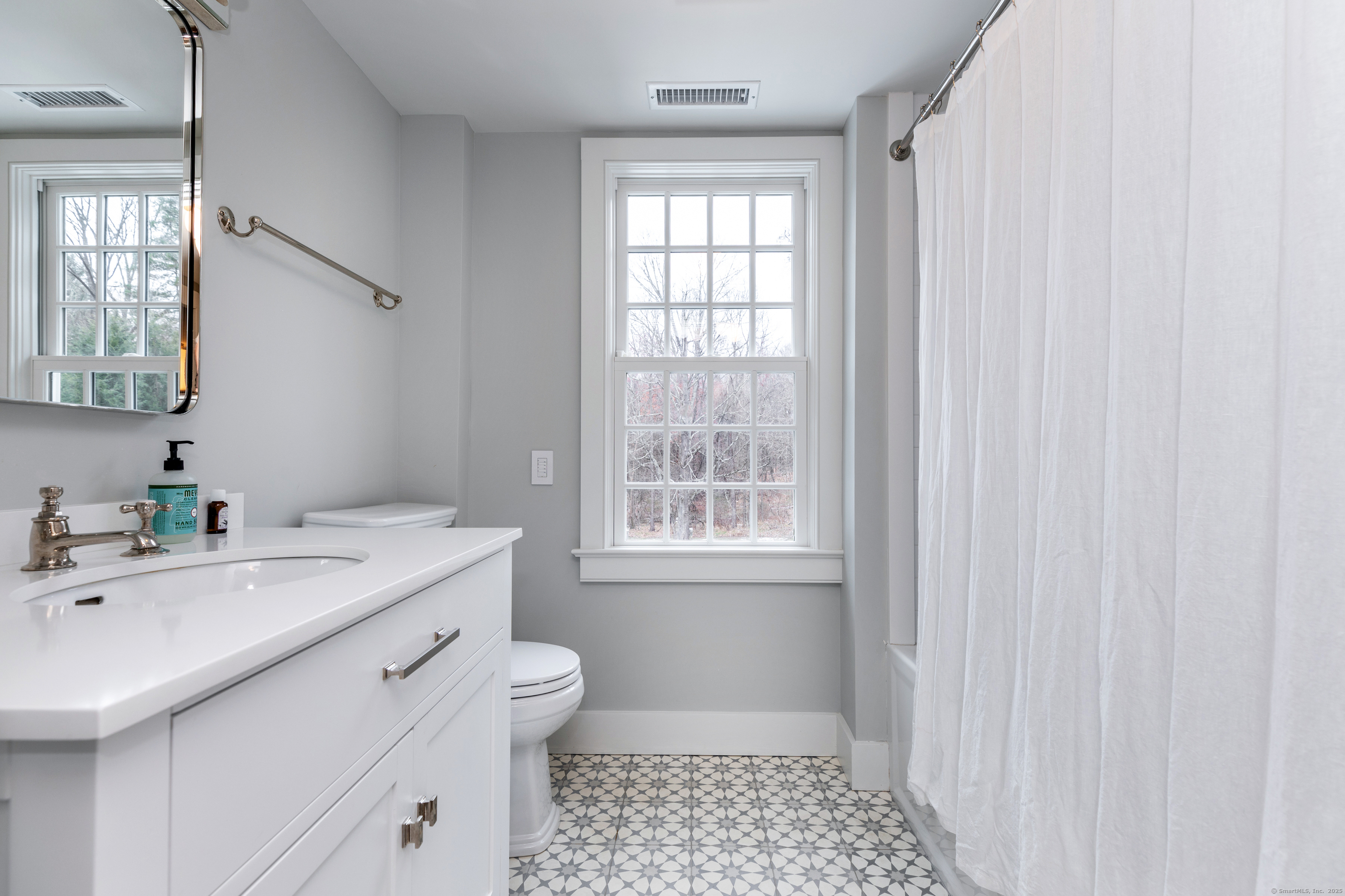 12 South Kent Road New Milford, CT 06755 - Photo 21 of 31 a bathroom with a sink a toilet and a window