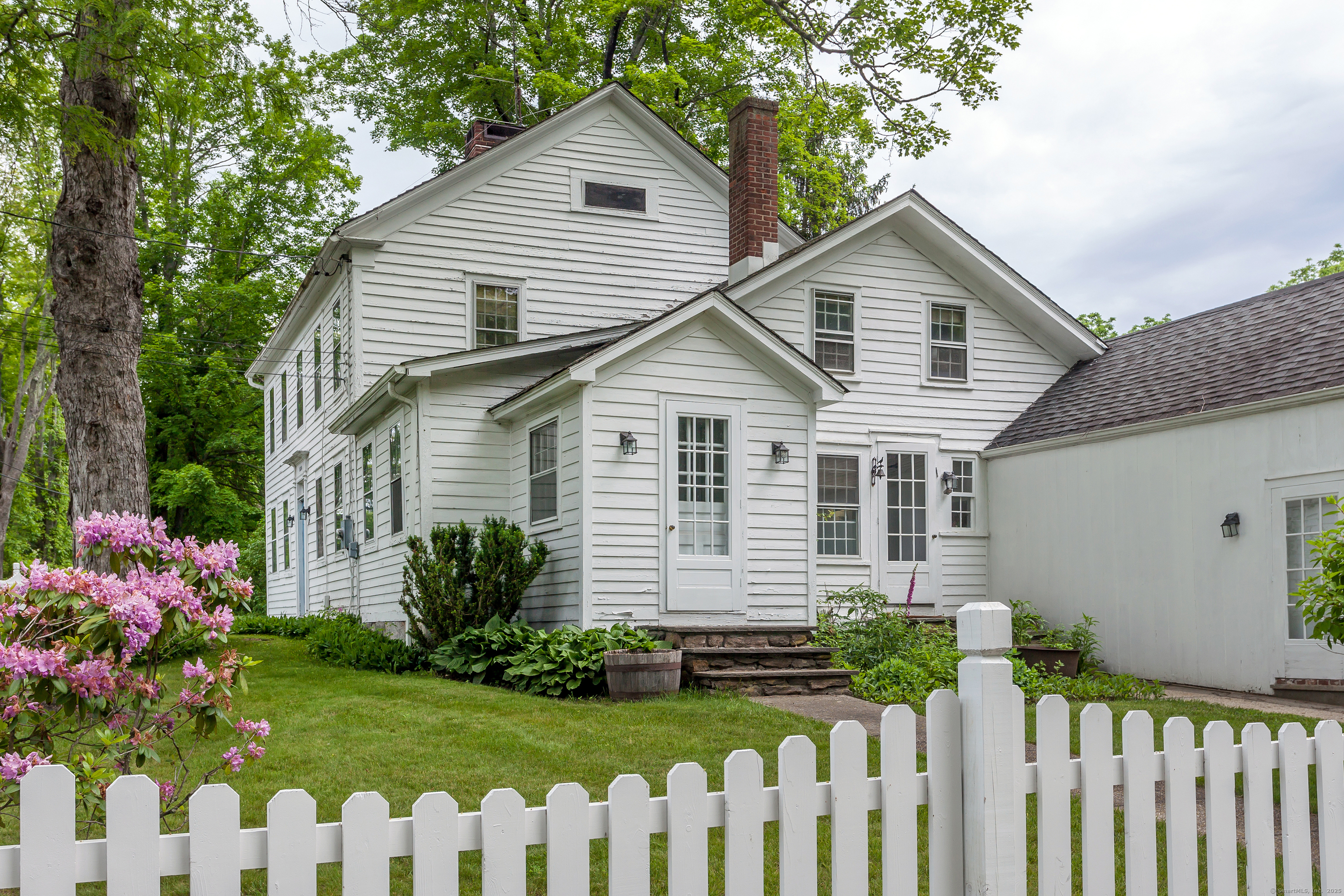 12 South Kent Road New Milford, CT 06755 - Photo 3 of 31 a front view of house with a garden