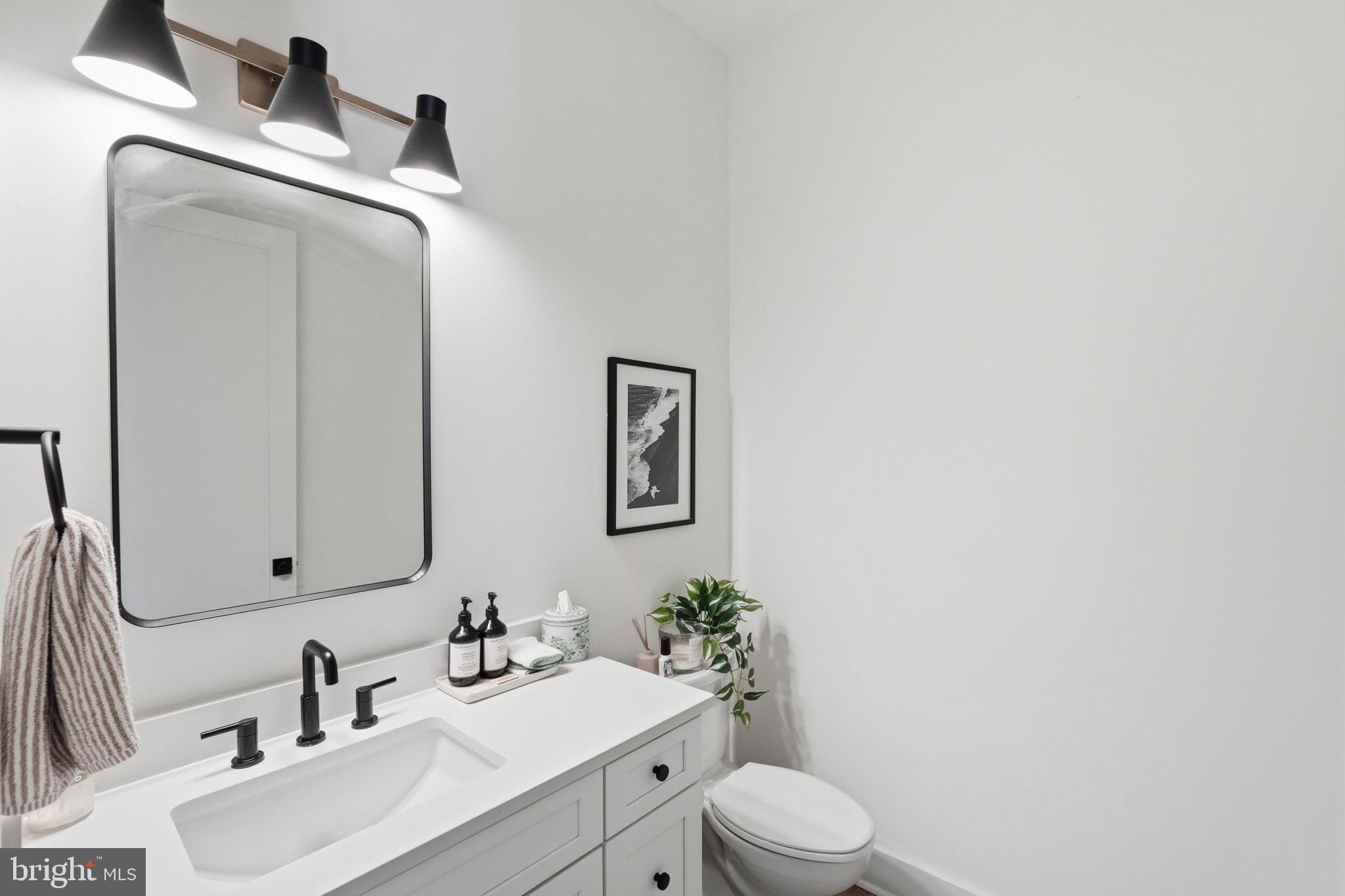 6026 Little Falls Road Arlington, VA 22207 - Photo 19 of 44 Main level powder bath off of entry foyer