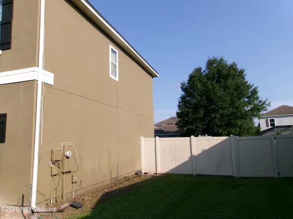 a view of a tree in front of a house