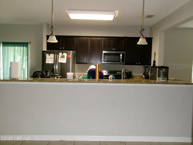 a room with gym equipment and a mirror