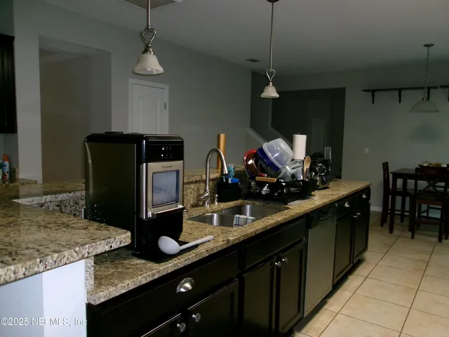 a bathroom with double sink and a mirror
