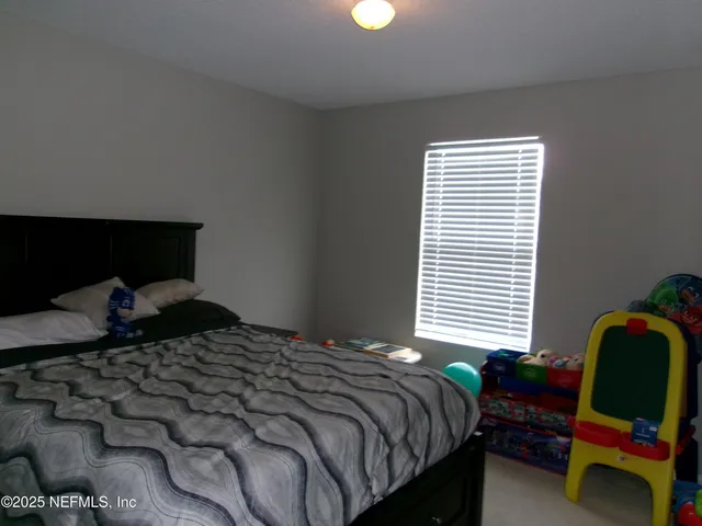 a view of a a dining room with furniture window and wooden floor