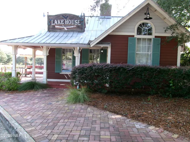 a view of a chairs and table in patio