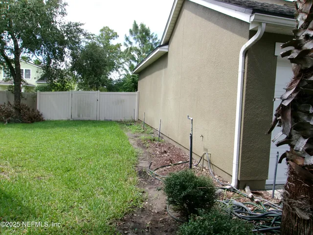 a backyard of a house with lots of green space