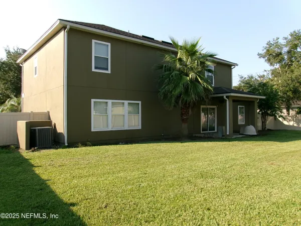 a backyard of a house with lots of green space