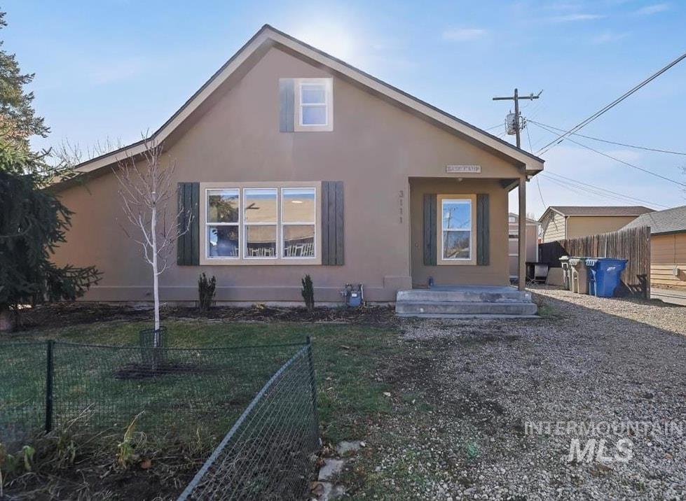 View of front facade with stucco siding