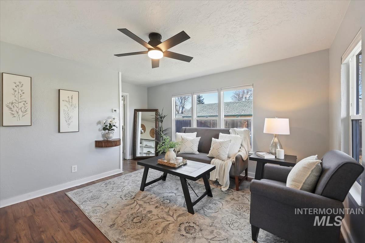 3111 West Palouse Street Boise, ID 83705 - Photo 12 of 32 Living room with a ceiling fan, wood finished floors, and a textured ceiling