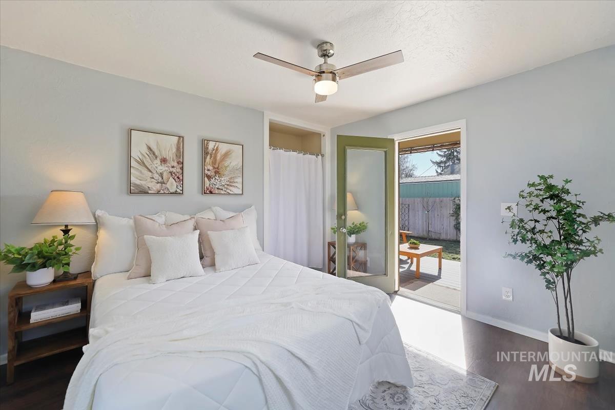 3111 West Palouse Street Boise, ID 83705 - Photo 16 of 32 Bedroom with dark wood-type flooring, access to exterior, and a ceiling fan