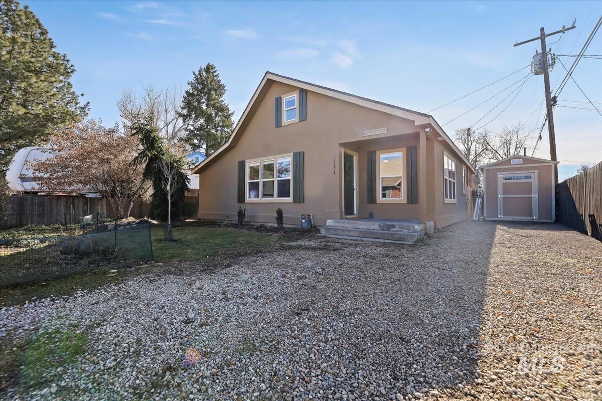 3111 West Palouse Street Boise, ID 83705 - Photo 2 of 32 View of front of house with a shed and stucco siding